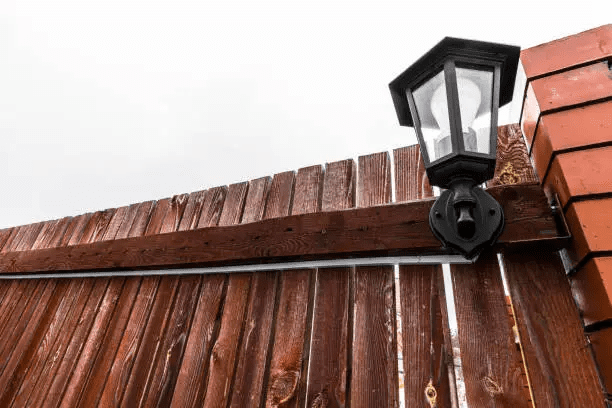 stained privacy fence with built-in lighting